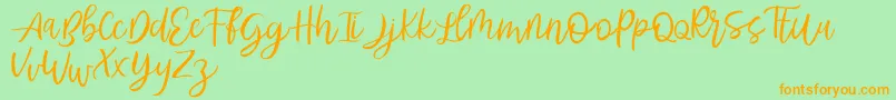 Abhyaksa FREE-Schriftart – Orangefarbene Schriften auf grünem Hintergrund