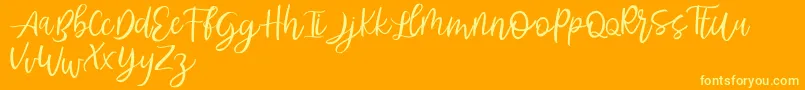 Abhyaksa FREE Font – Yellow Fonts on Orange Background