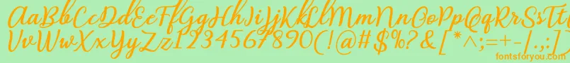 フォントAbilya Regular Font by 7NTypes – オレンジの文字が緑の背景にあります。