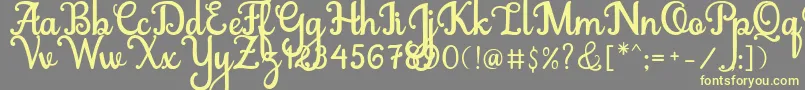 Abiyells Font – Yellow Fonts on Gray Background