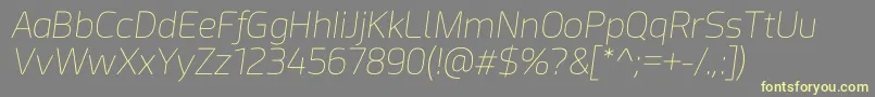 Acephimere Thin Italic-Schriftart – Gelbe Schriften auf grauem Hintergrund