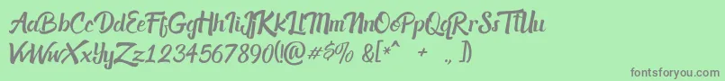 フォントacknesia – 緑の背景に灰色の文字