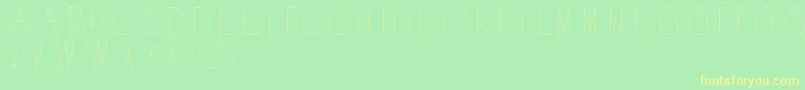 フォントAcorn – 黄色の文字が緑の背景にあります