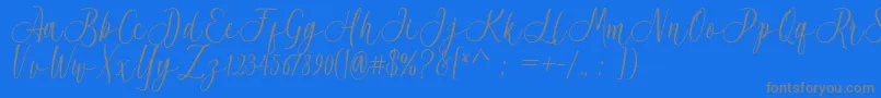 Acrobad-fontti – harmaat kirjasimet sinisellä taustalla