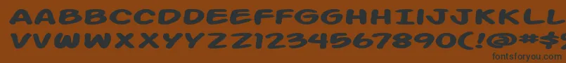 フォントAction Man Extended Bold – 黒い文字が茶色の背景にあります