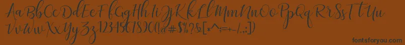 Шрифт adaline script   regular – чёрные шрифты на коричневом фоне