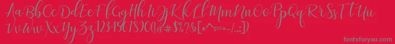 adaline script   regular-fontti – harmaat kirjasimet punaisella taustalla