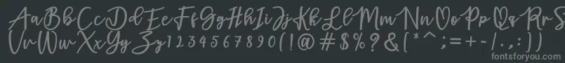 フォントadamd – 黒い背景に灰色の文字