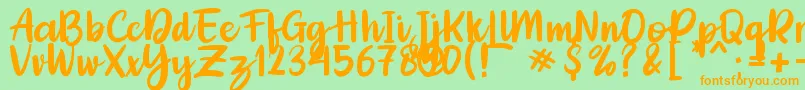 Adelica Brush Font – Orange Fonts on Green Background