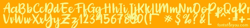 Adelica Brush Font – Yellow Fonts on Orange Background