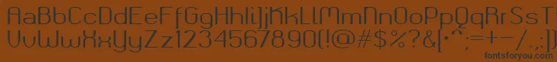 フォントOkolaksregular – 黒い文字が茶色の背景にあります