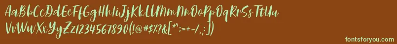 フォントAdelio Darmanto Font by Keithzo 7NTypes – 緑色の文字が茶色の背景にあります。