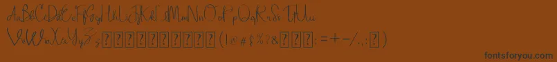 Adellina Font – Black Fonts on Brown Background