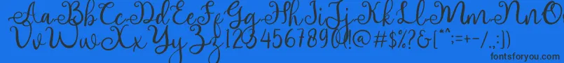 adhellita Font – Black Fonts on Blue Background