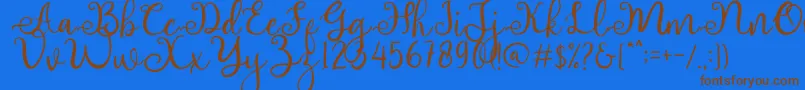 adhellita Font – Brown Fonts on Blue Background