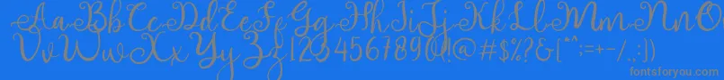 adhellita-Schriftart – Graue Schriften auf blauem Hintergrund