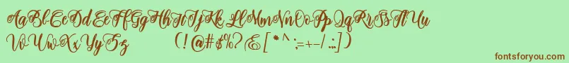 Fonte adinda script – fontes marrons em um fundo verde