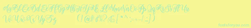 adinda script-fontti – vihreät fontit keltaisella taustalla