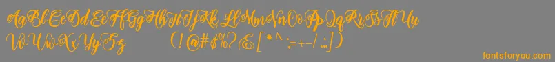 adinda script Font – Orange Fonts on Gray Background
