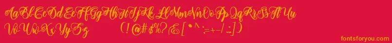 フォントadinda script – 赤い背景にオレンジの文字
