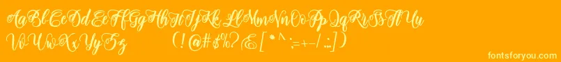 adinda script-Schriftart – Gelbe Schriften auf orangefarbenem Hintergrund