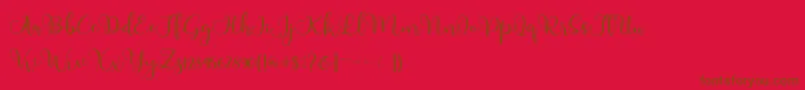 フォントAdinda – 赤い背景に茶色の文字