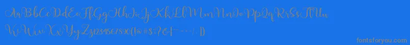 Adinda-Schriftart – Graue Schriften auf blauem Hintergrund