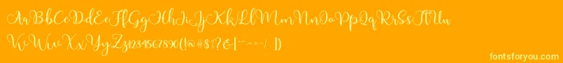Adinda-Schriftart – Gelbe Schriften auf orangefarbenem Hintergrund