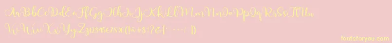 Adinda-fontti – keltaiset fontit vaaleanpunaisella taustalla
