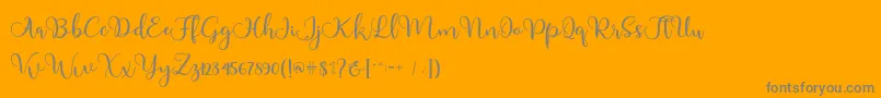 Adinda-Schriftart – Graue Schriften auf orangefarbenem Hintergrund