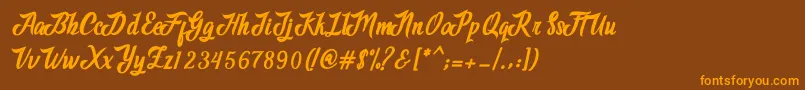 Czcionka Adventure Script – pomarańczowe czcionki na brązowym tle