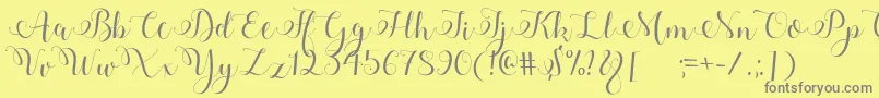 Adyana Font – Gray Fonts on Yellow Background