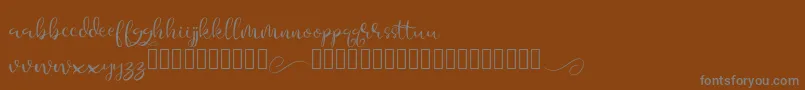 Aesteh-Schriftart – Graue Schriften auf braunem Hintergrund