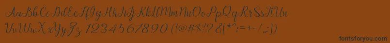Afrile script Font – Black Fonts on Brown Background