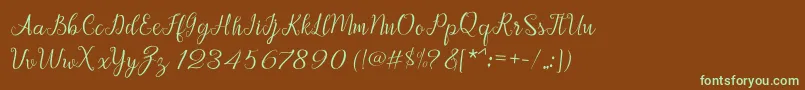 フォントAfrile script – 緑色の文字が茶色の背景にあります。