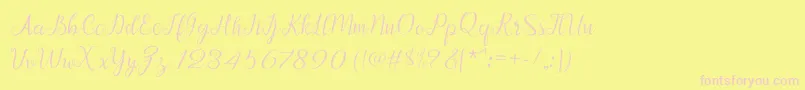 Afrile script-fontti – vaaleanpunaiset fontit keltaisella taustalla