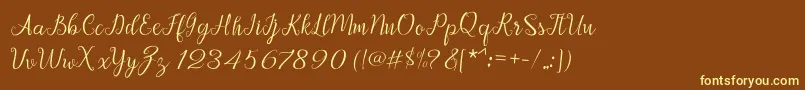 Afrile script-Schriftart – Gelbe Schriften auf braunem Hintergrund