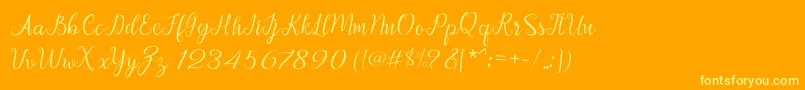 Afrile script Font – Yellow Fonts on Orange Background