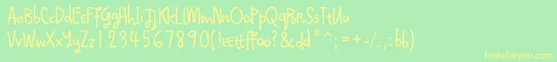 Qokijo Font – Yellow Fonts on Green Background