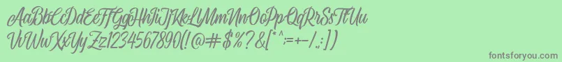 フォントAirplane Script – 緑の背景に灰色の文字