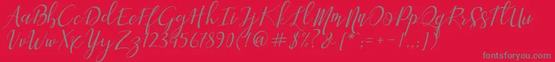 フォントAisyah – 赤い背景に灰色の文字