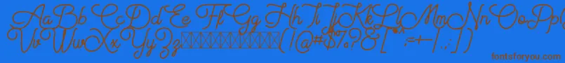 Aiushtya Free-Schriftart – Braune Schriften auf blauem Hintergrund