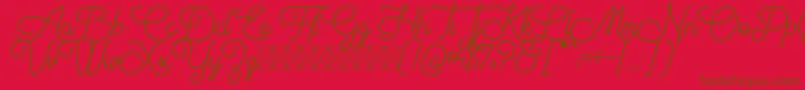 Aiushtya Free-Schriftart – Braune Schriften auf rotem Hintergrund