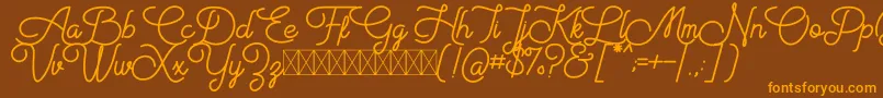 Aiushtya Free Font – Orange Fonts on Brown Background