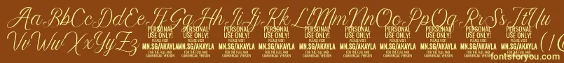 AkaylaScript PERSONAL Font – Yellow Fonts on Brown Background