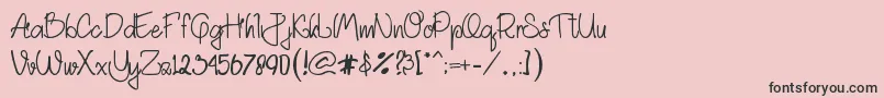 フォントAkhadias – ピンクの背景に黒い文字