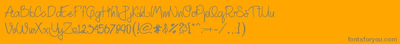 フォントAkhadias – オレンジの背景に灰色の文字