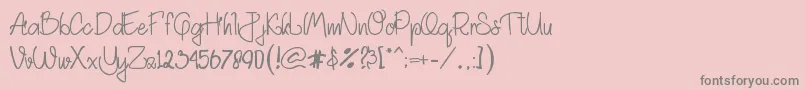 フォントAkhadias – ピンクの背景に灰色の文字