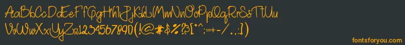 フォントAkhadias – 黒い背景にオレンジの文字