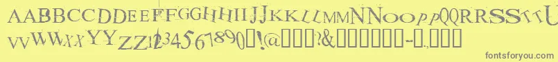Fonte AKOOM    – fontes cinzas em um fundo amarelo